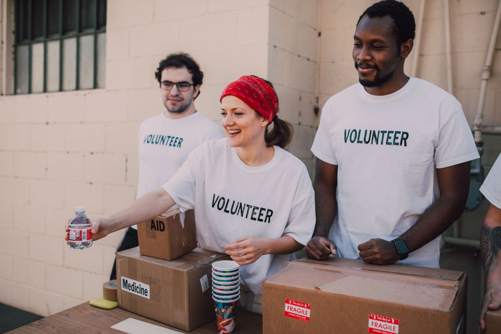 Volunteers handing out water and supplies